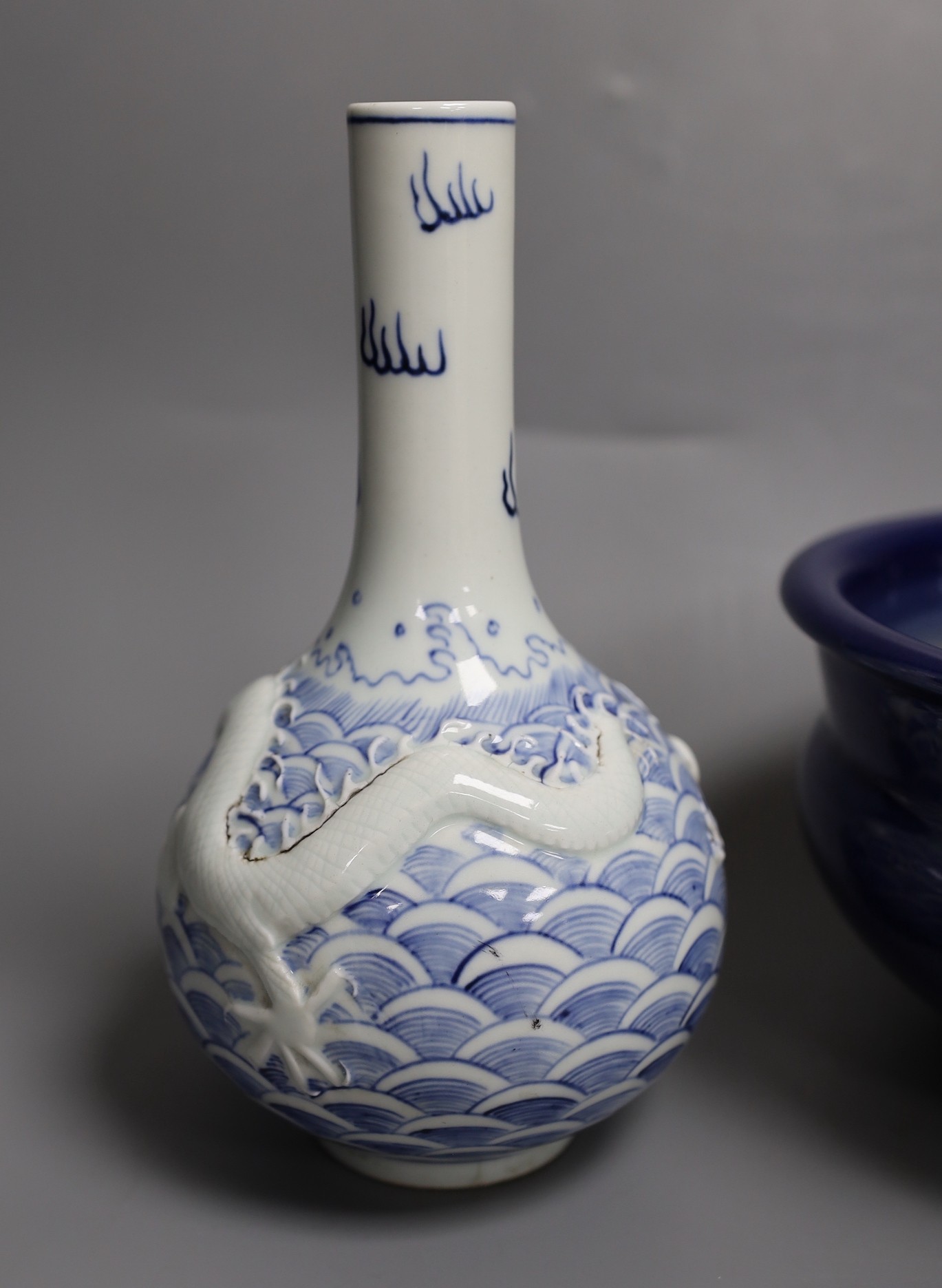 A Chinese blue and white ‘dragon’ bottle vase and a large blue glazed censer, diameter 23cm